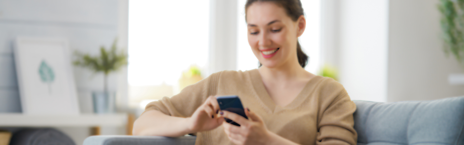 woman on phone on couch